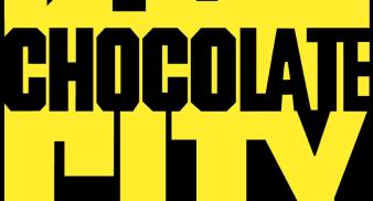 Black and yellow font, the words "chocolate" on top and "city" on bottom, yellow skyline on top of the word "chocolate."
